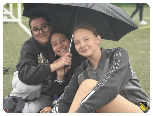 Girls under umbrella